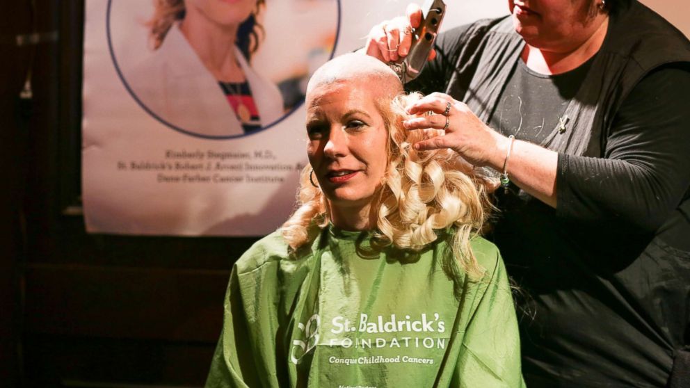 One bride honored her late mother, who died from cancer, by shaving off her hair two months ahead of her wedding to raise money for children's cancer research.
