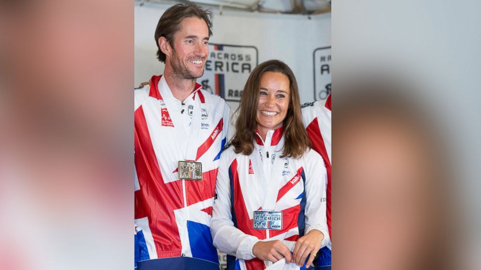 PHOTO: Pippa Middleton and James Matthews pose for photos after finishing their Race Across America bike race in Annapolis, Maryland, June, 21, 2014.