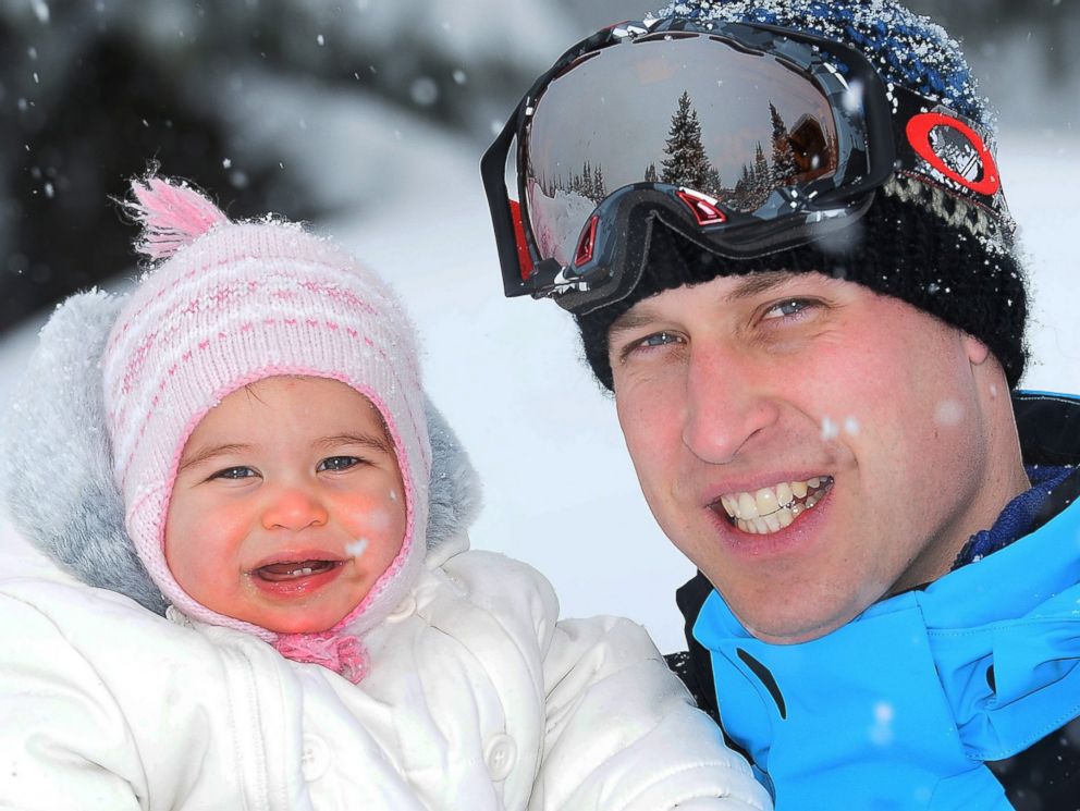 PHOTO: A picture made available March 7, 2016 shows Prince William (R), Duke of Cambridge cuddling his daughter Princess Charlotte of Cambridge as he and his family enjoy a short private break skiing in the French Alps, France, March 3, 2016.  