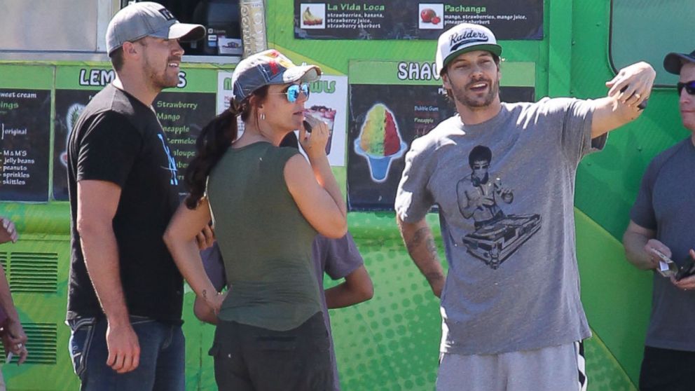Britney Spears, her boyfriend David Lucado and her ex-husband Kevin Federline talk while watching their sons Sean and Jayden play soccer in Calabasas, Calif., March 9, 2014.