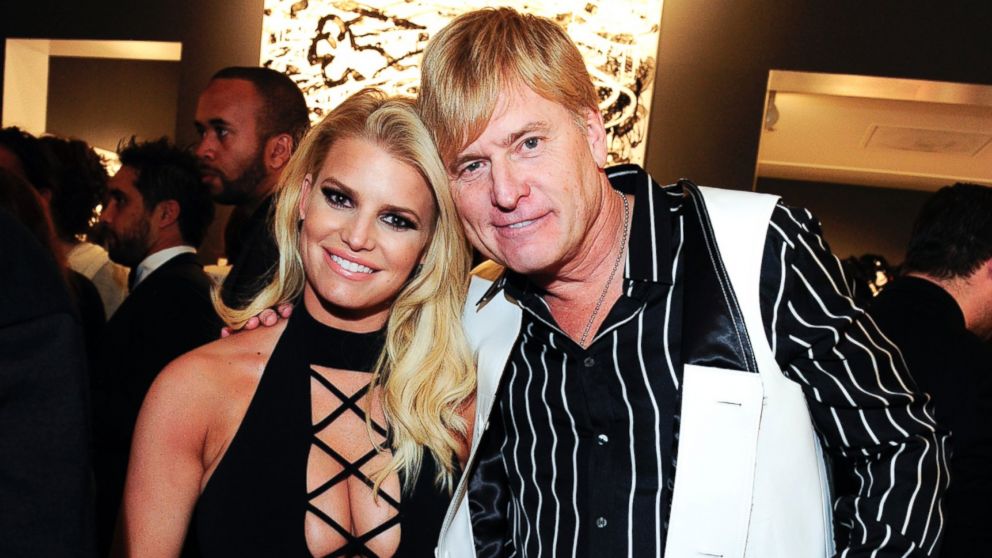 Jessica Simpson and Joe Simpson attend the "Tom Everhart Raw" exhibition of his Schulz-influenced paintings for the first time in Black And White at the Mouche Gallery, on Feb. 27, 2016 in  Beverly Hills, California. 