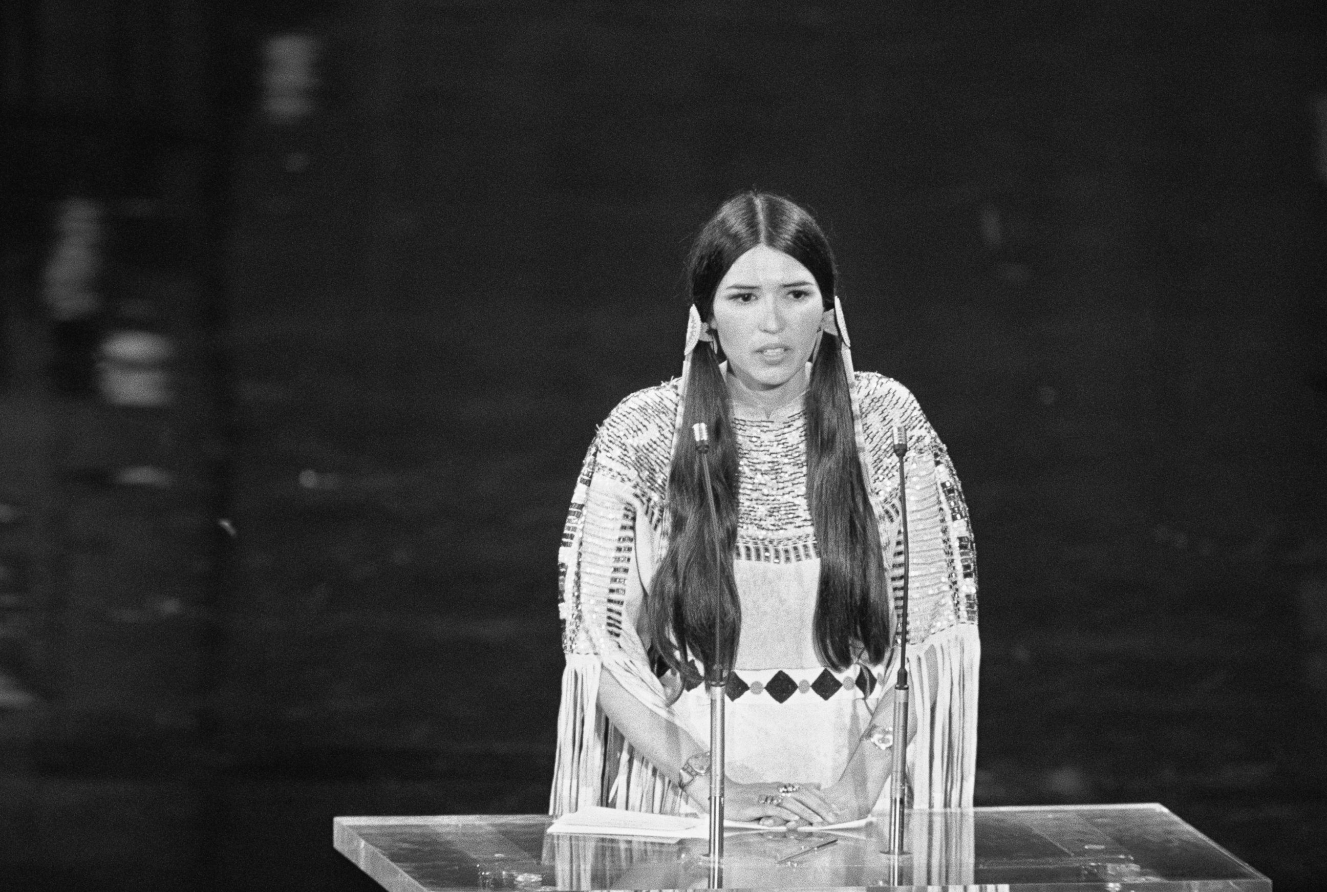 PHOTO: Native American Sacheen Littlefeather speaks at the 45th Academy Awards on behalf of Marlon Brando, she refused the Best Actor award he was awarded for his role in Godfather, March 27, 1973. 