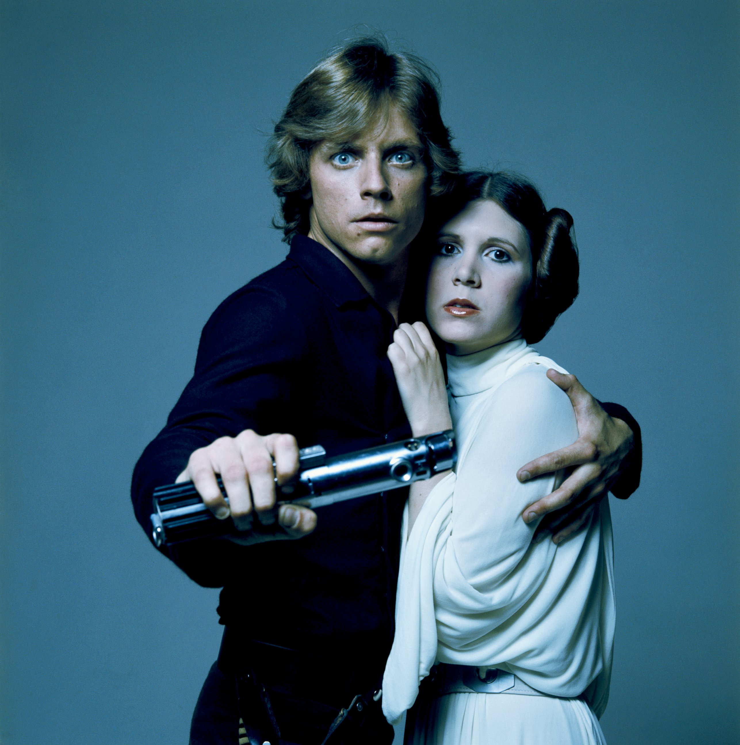 PHOTO: American actors Mark Hamill and Carrie Fisher in costume as brother and sister Luke Skywalker and Princess Leia in George Lucas' Star Wars trilogy in this 1977 file photo.