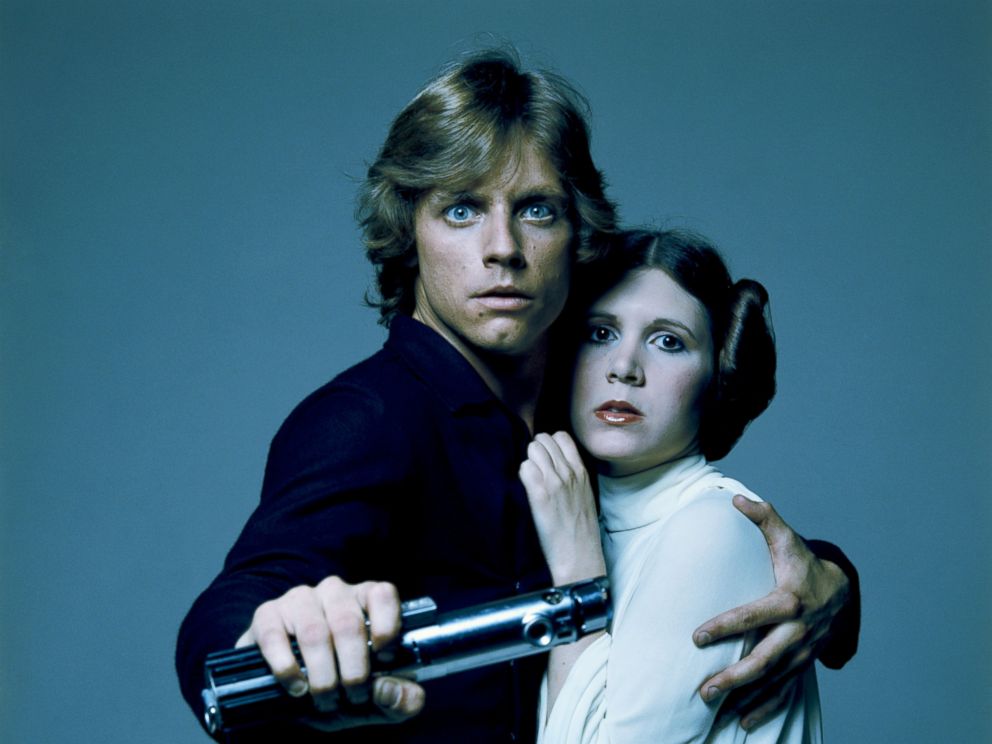PHOTO: American actors Mark Hamill and Carrie Fisher in costume as brother and sister Luke Skywalker and Princess Leia in George Lucas Star Wars trilogy in this 1977 file photo.