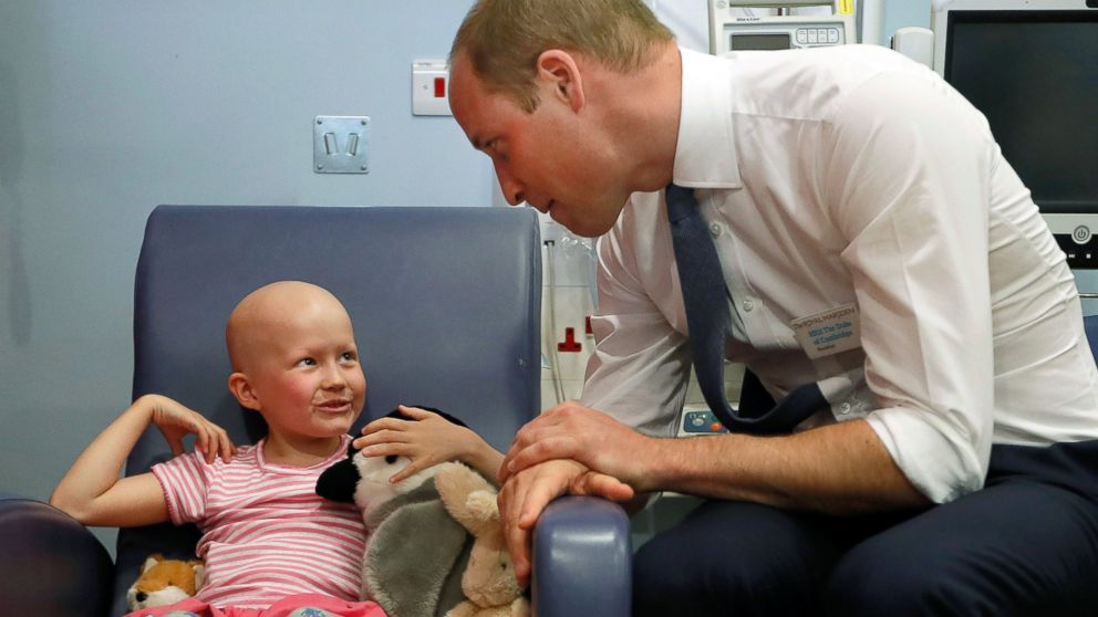 Britain's Prince William, Duke of Cambridge talks with patient Daisy Wood, 6, during a visit to the Royal Marsden hospital in Sutton, UK on May 16, 2017. The Duke of Cambridge is President of the Royal Marsden NHS Foundation Trust.