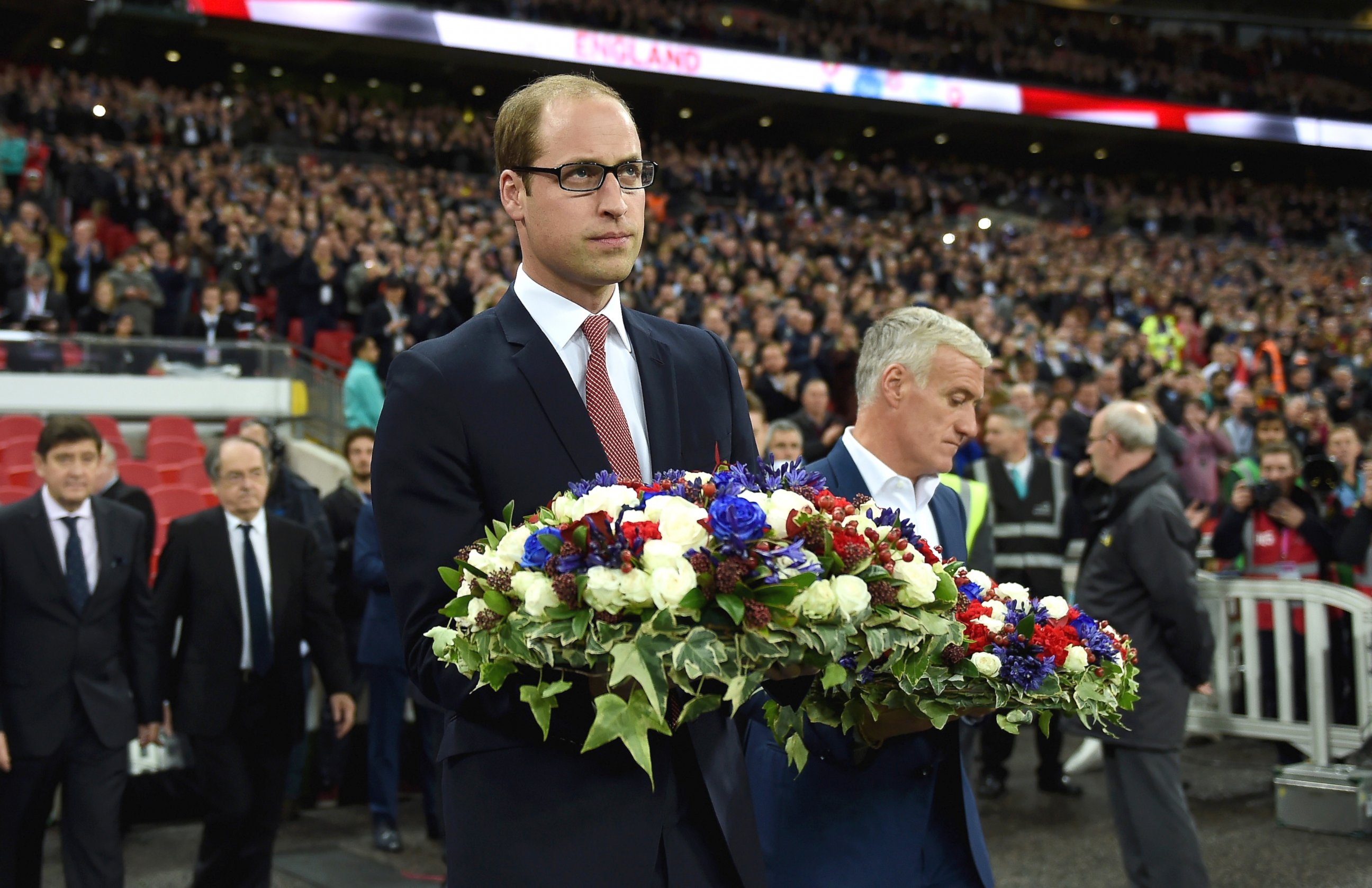 PHOTO: Prince William, The Duke of Cambridge holds the floral tribute during the International Friendly match between England and France at Wembley Stadium, on Nov. 17, 2015, in London.