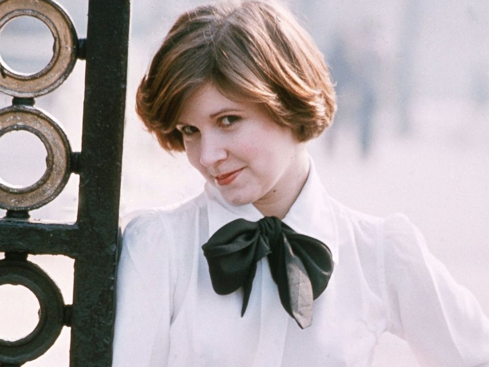 PHOTO: Carrie Fisher poses for a photo against metal gate, Feb. 1, 1975.