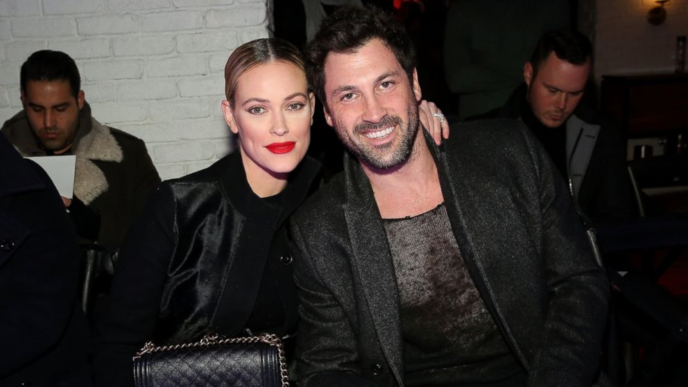 Peta Murgatroyd, left, and Maksim Chmerkovskiy attend the VALENTINNICOLE fashion show during New York Fashion Week at Lovage, Feb. 9, 2017 in New York City.  