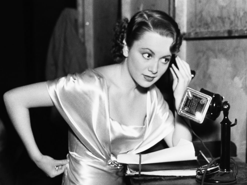 PHOTO: Olivia De Havilland standing in an undated photo with telephone to her ear. 