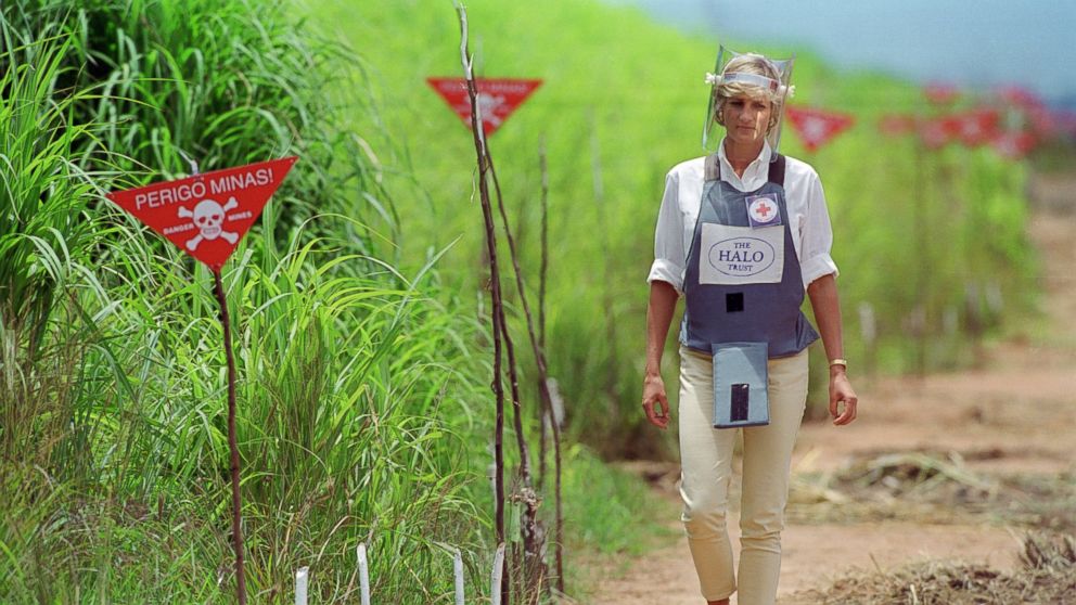 PHOTO: Diana, Princess of Wales wears protective body armor and a visor while visting a landmine minefield being cleared by the charity Halo in Huambo, Angola. 