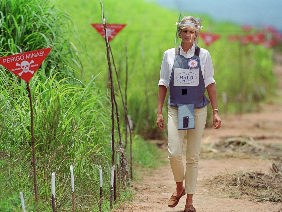 PHOTO: Diana, Princess of Wales wears protective body armor and a visor while visting a landmine minefield being cleared by the charity Halo in Huambo, Angola.