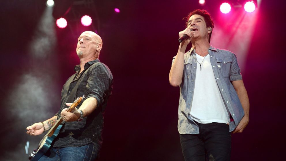 Guitarist Jimmy Stafford and singer Pat Monahan of Train perform onstage during 2015 KAABOO Del Mar, Sept. 20, 2015, in Del Mar, California.