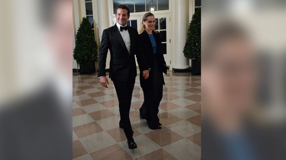 Actor Bradley Cooper and Suki Waterhouse arrive at the White House for the state dinner in honor of French President Francois Hollande on Feb. 11, 2014. 