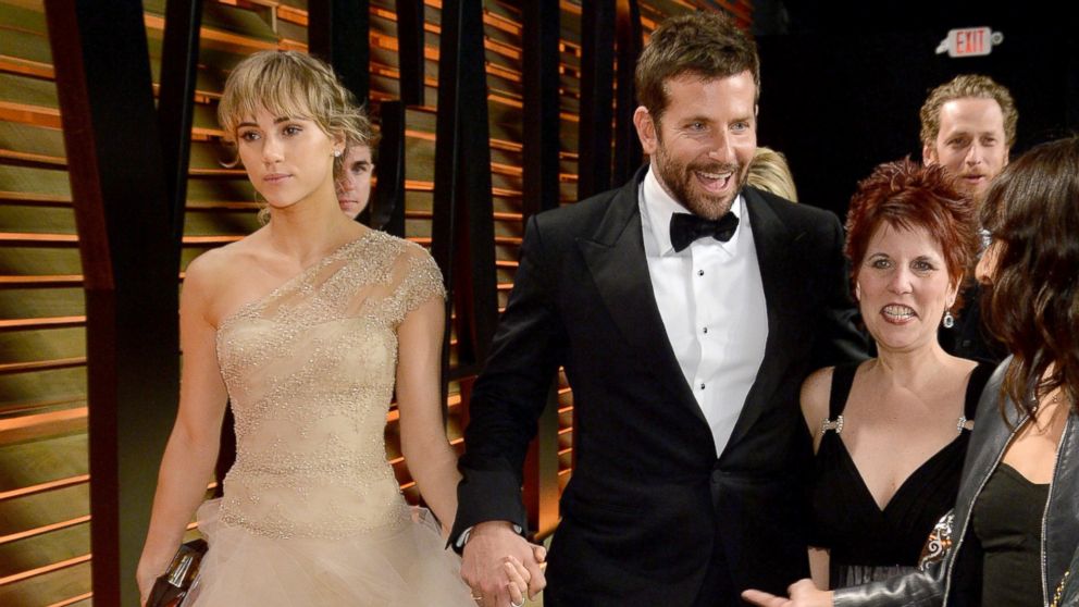 Model Suki Waterhouse, left, and actor Bradley Cooper, center, attend the 2014 Vanity Fair Oscar Party in West Hollywood, Calif. on March 2, 2014.  