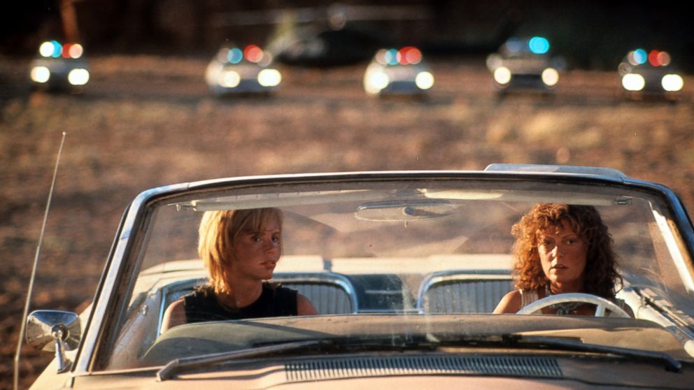 PHOTO: Geena Davis and Susan Sarandon sitting in their convertible with squad cars behind them in a scene from the film 'Thelma & Louise' in 1991.