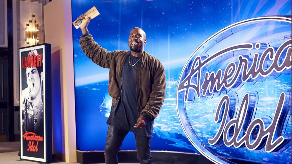 Kanye West shows off his Golden Ticket from the auditions of American Idol on Oct. 10, 2015 in San Francisco.