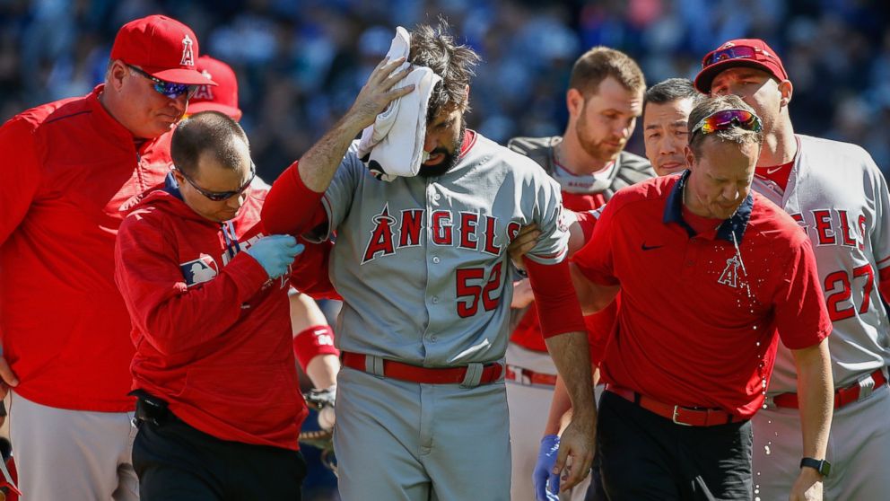 PHOTO: Starting pitcher Matt Shoemaker, #52 of the Los Angeles Angels of Anaheim, is helped off the field after being hit in the head with a batted ball off the bat of Kyle Seager of the Seattle Mariners, on Sept. 4, 2016, in Seattle.