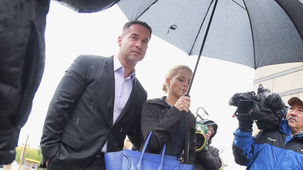 Mike "The Situation" Sorrentino and fiancee Lauren Pesce appear for Sorrentino's arraignment on tax fraud charges at the Martin Luther King Building and U.S. Courthouse, Oct. 23, 2014, in Newark, N.J.   