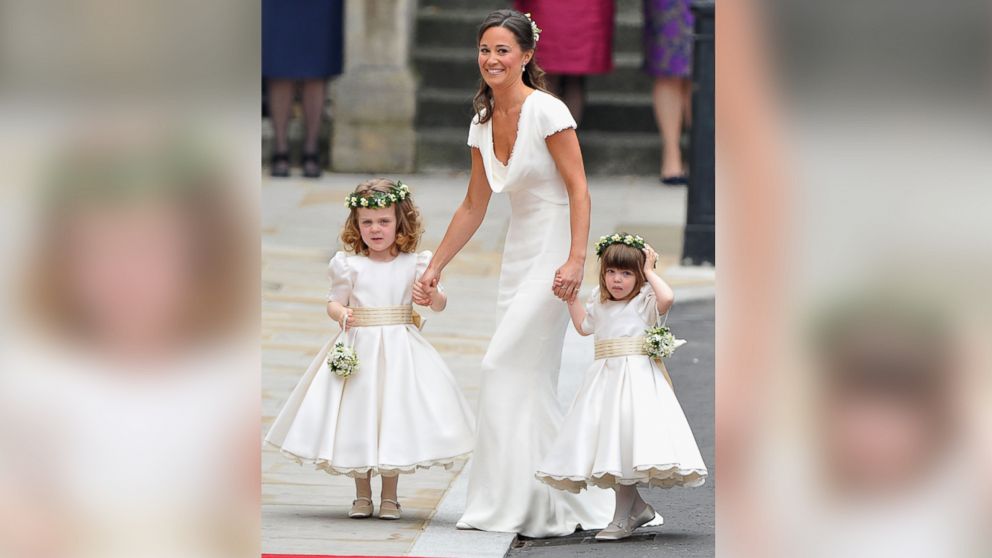 Sister of the bride and Maid of Honour Pippa Middleton holds hands with Grace Van Cutsem and Eliza Lopes as they arrive to attend the Royal Wedding in this April 29, 2011, file photo. 