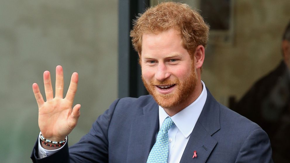 Prince Harry waves as he leaves after a visit to Mildmay, a dedicated HIV hospital, to mark the opening of the new purpose built facility at Mildmay Hospital on Dec. 14, 2015 in London.