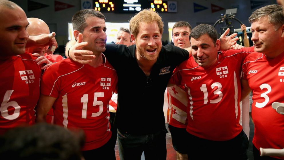 Prince Harry huddles with the Georgia team after they were beaten by the UK Armed Forces Team at sitting volleyball during the Invictus Games Orlando 2016 at ESPN Wide World of Sports on May 10, 2016 in Orlando, Florida. 