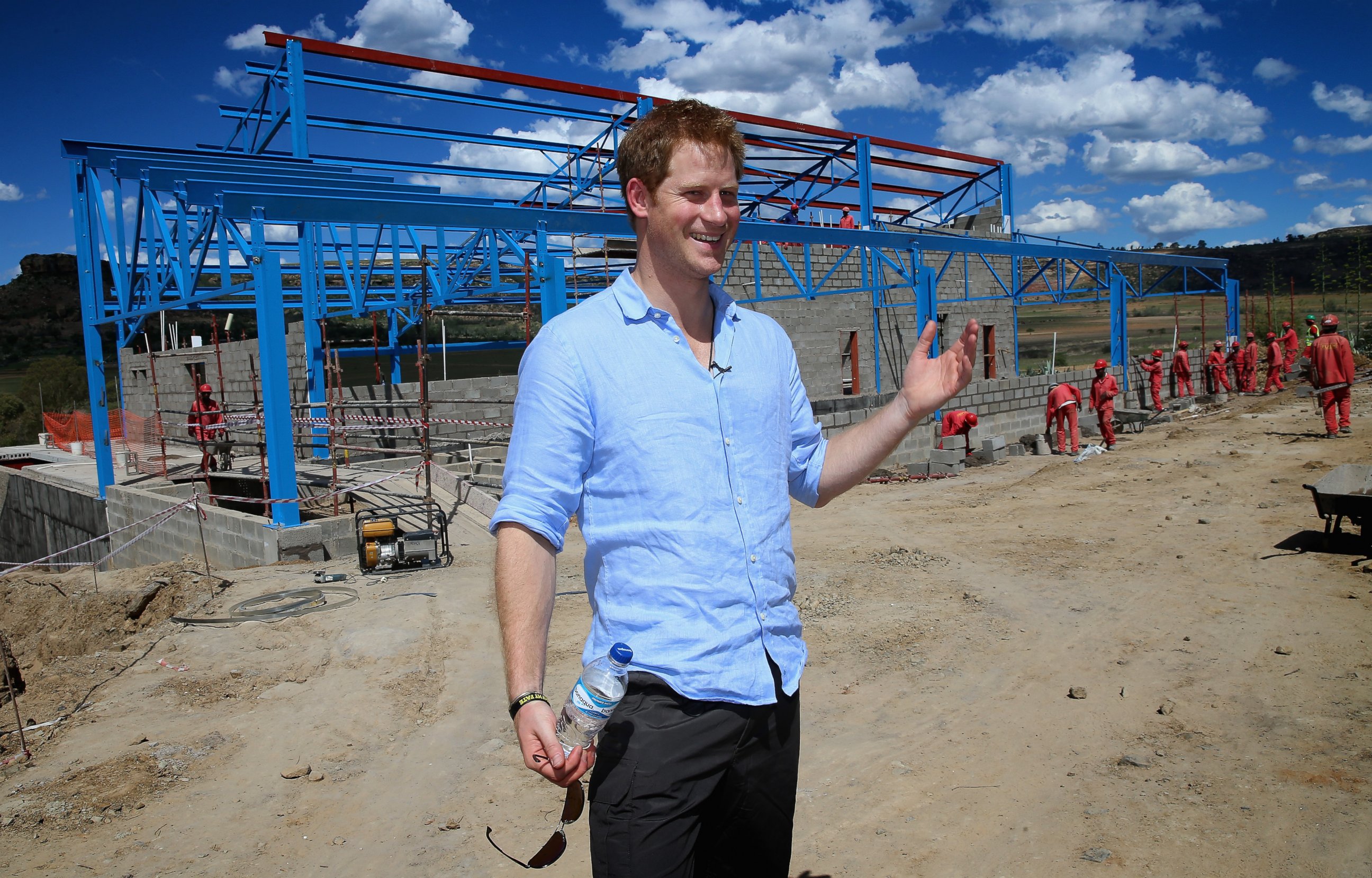 PHOTO: Prince Harry poses for a photograph in front of the dining room at the construction site for the new Mamohato Children's Centre at Thaba-Bosiu on Dec. 5, 2014 in Maseru, Lesotho. 
