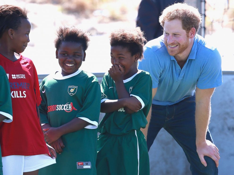 PHOTO:Prince Harry laughs with young girls during a visit to a Football for Hope session with Grassroots Soccer in Khayelitsha, Nov. 30, 2015,in Cape Town, South Africa.  