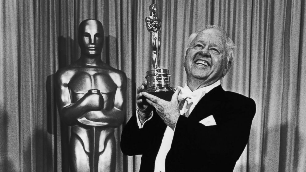 Film actor Mickey Rooney poses with the "Lifetime Achievement" Academy Award backstage, following his acceptance speech, at the 1982 Academy Awards in Los Angeles, California.