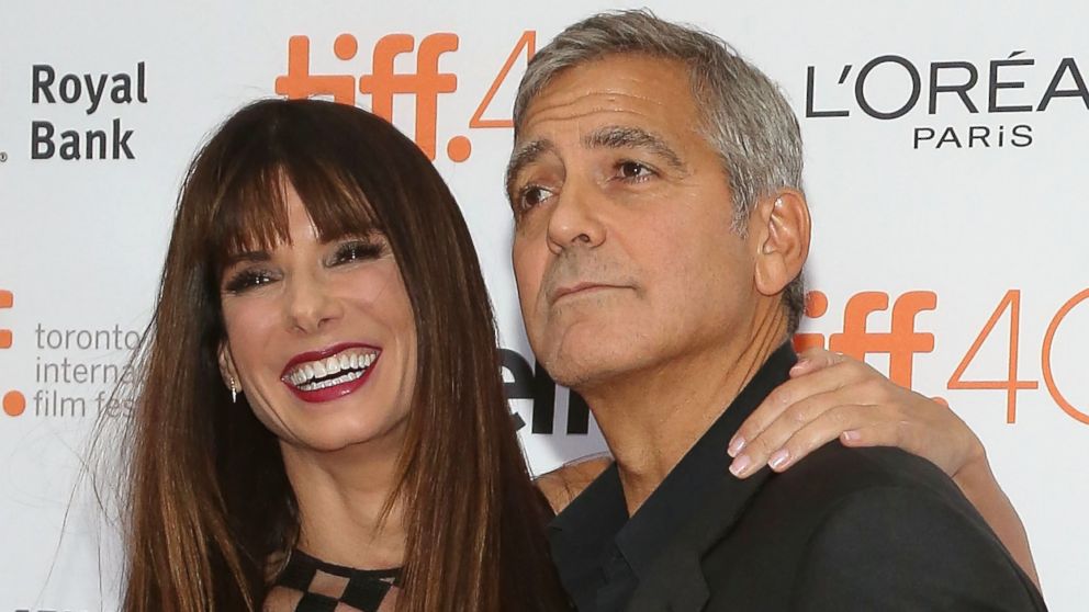 George Clooney and Sandra Bullock attend the premiere of "Our Brand is Crisis" at the Princess of Wales Theatre during the 2015 Toronto International Film Festival, Sept. 11, 2015, in Toronto.