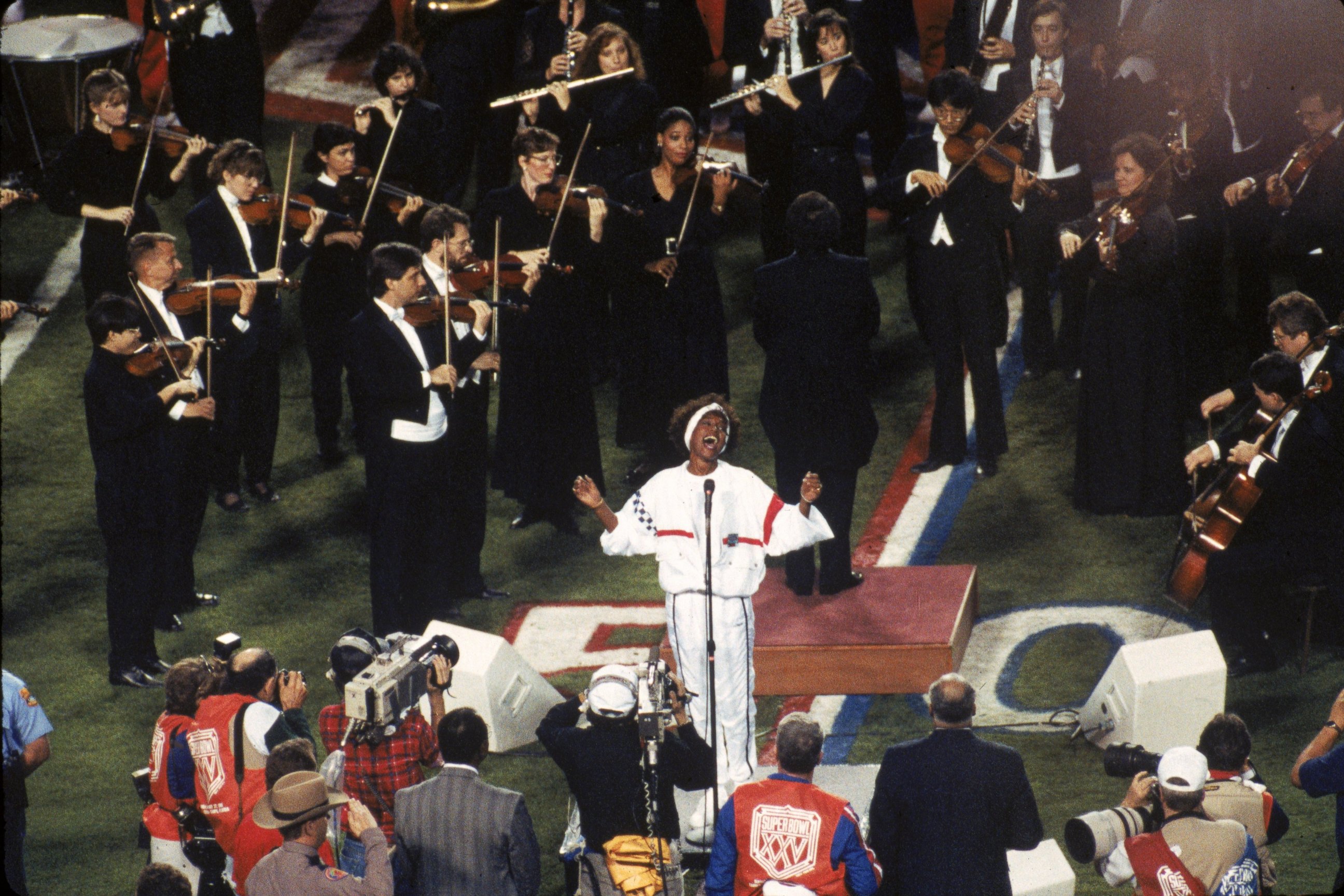 PHOTO: Whitney Houston sings the National Anthem before the New York Giants took on the Buffalo Bills in Super Bowl XXV at Tampa Stadium on Jan. 27, 1991 in Tampa, Fla. 