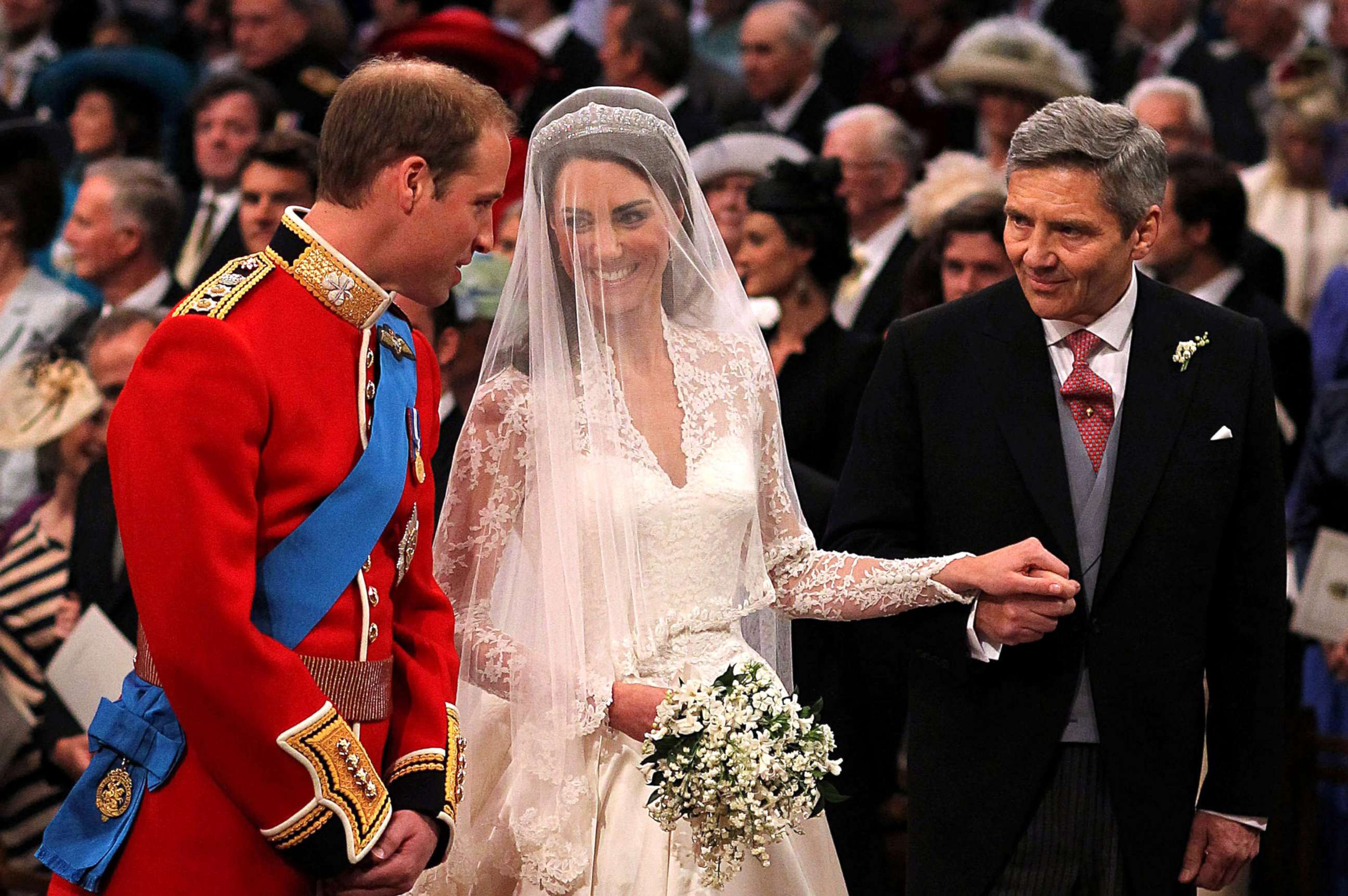 PHOTO:Prince William speaks to his bride, Catherine Middleton as she holds the hand of her father Michael Middleton at Westminster Abbey, April 29, 2011, in London. 