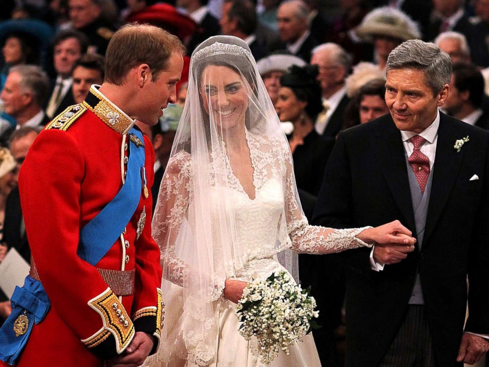 PHOTO:Prince William speaks to his bride, Catherine Middleton as she holds the hand of her father Michael Middleton at Westminster Abbey, April 29, 2011, in London.