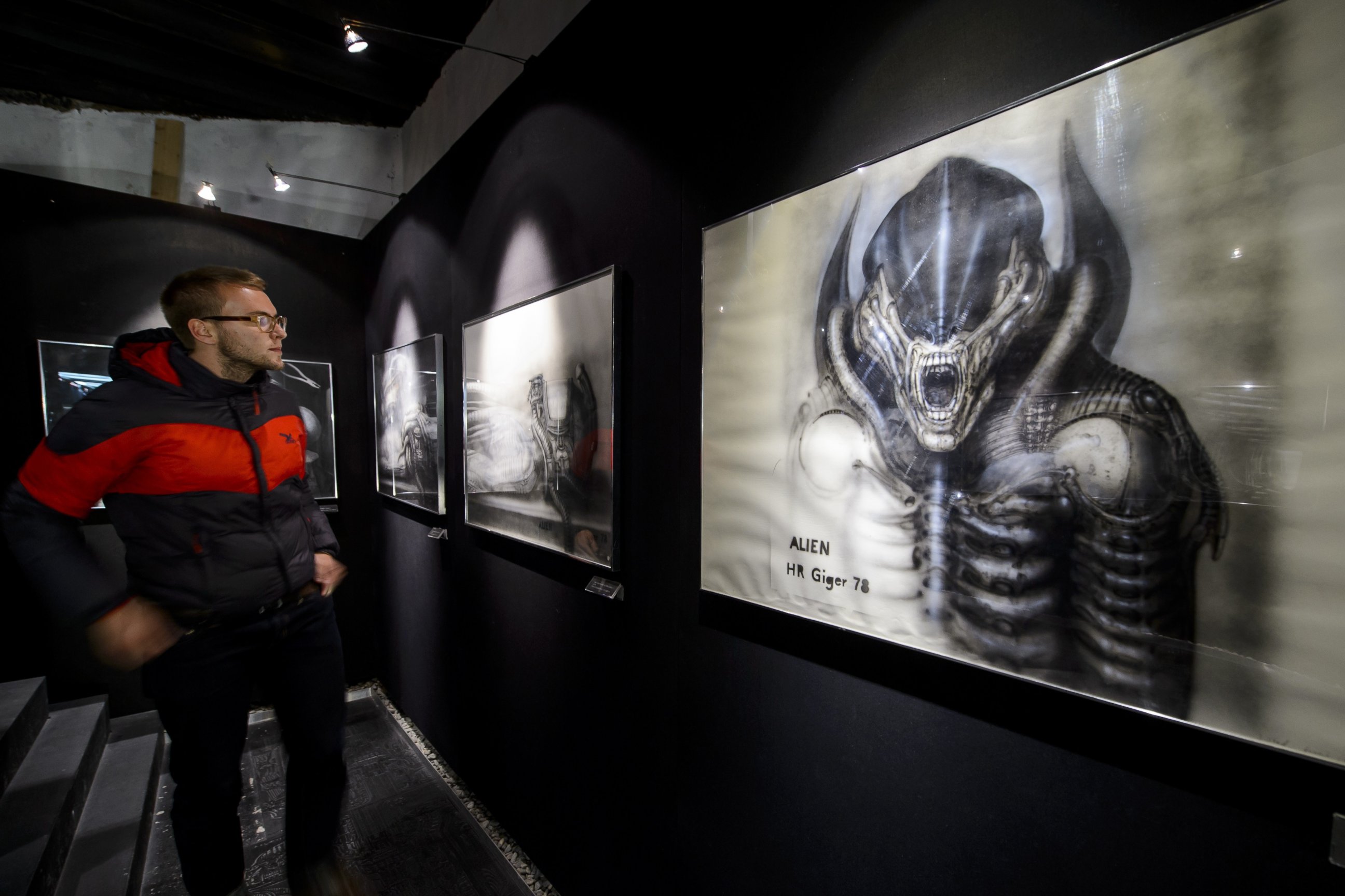 PHOTO: A visitor faces a preparatory sketch for "Alien" movie at the HR Giger Museum on May 13, 2014 in Gruyeres. 