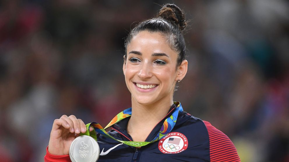 US gymnast Alexandra Raisman celebrates on the podium of the women's floor event final of the Artistic Gymnastics at the Olympic Arena during the Rio 2016 Olympic Games, Aug.16, 2016. 