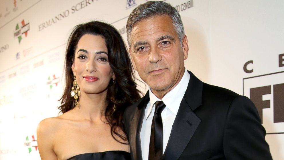 Amal Alamuddin and George Clooney attend the Celebrity Fight Night gala celebrating Celebrity Fight Night In Italy benefiting The Andrea Bocelli Foundation and The Muhammad Ali Parkinson Center, Sept. 7, 2014, in Florence, Italy.