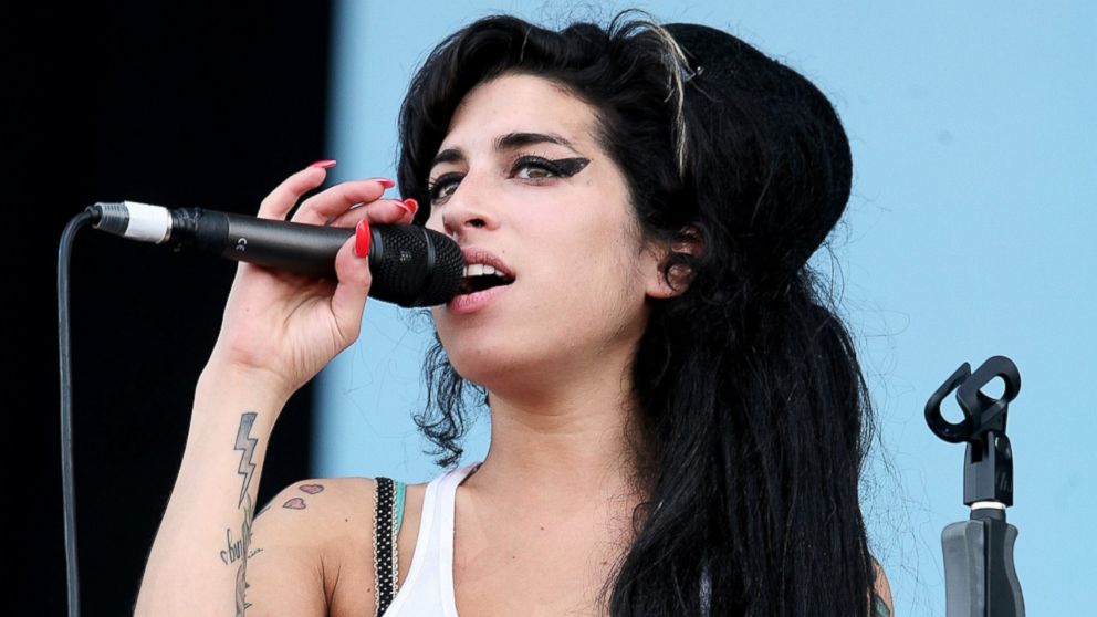 Amy Winehouse performs on stage on the second day of the Isle of Wight Festival 2007 in Newport, June 9, 2007 on the Isle of Wight, England. 