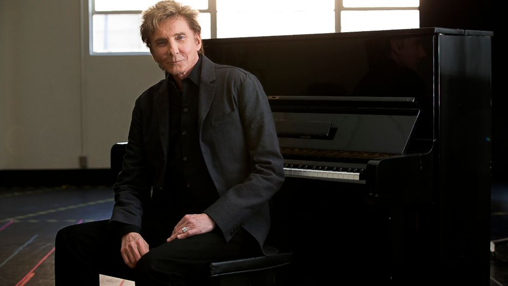 In this file photo, Barry Manilow sits for a portrait at the Music Center Annex Complex, Feb. 23, 2014, in Los Angeles.