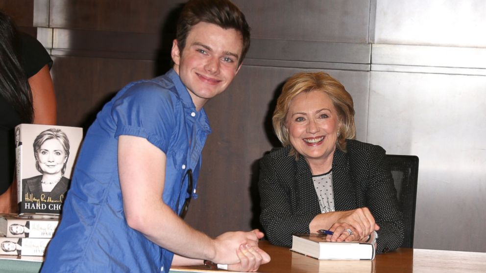Chris Colfer poses for a photo with Hillary Rodham Clinton during a book signing for "Hard Choices" at Barnes & Noble at The Grove in Los Angeles, June 19, 2014.