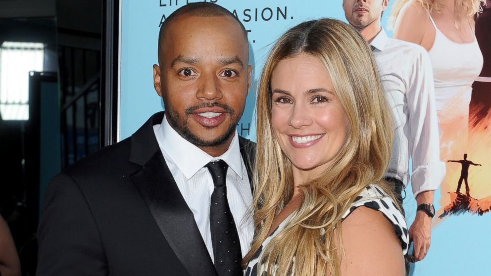 Donald Faison and wife Cacee Cobb arrive at the Los Angeles Premiere 'Wish I Was Here' at the DGA Theater, June 23, 2014, in Los Angeles.