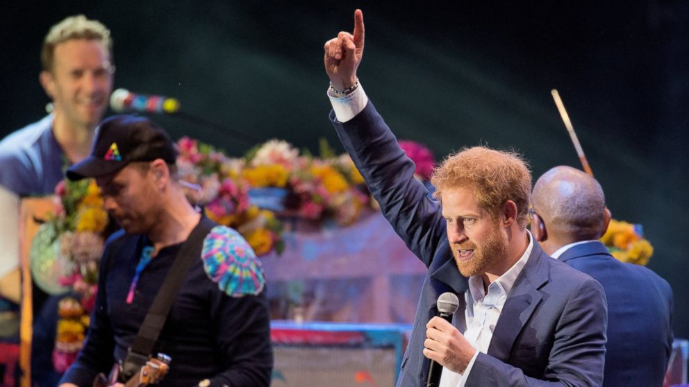Prince Harry joins Coldplay on stage during the Sentebale Concert at Kensington Palace, June 28, 2016 in London.