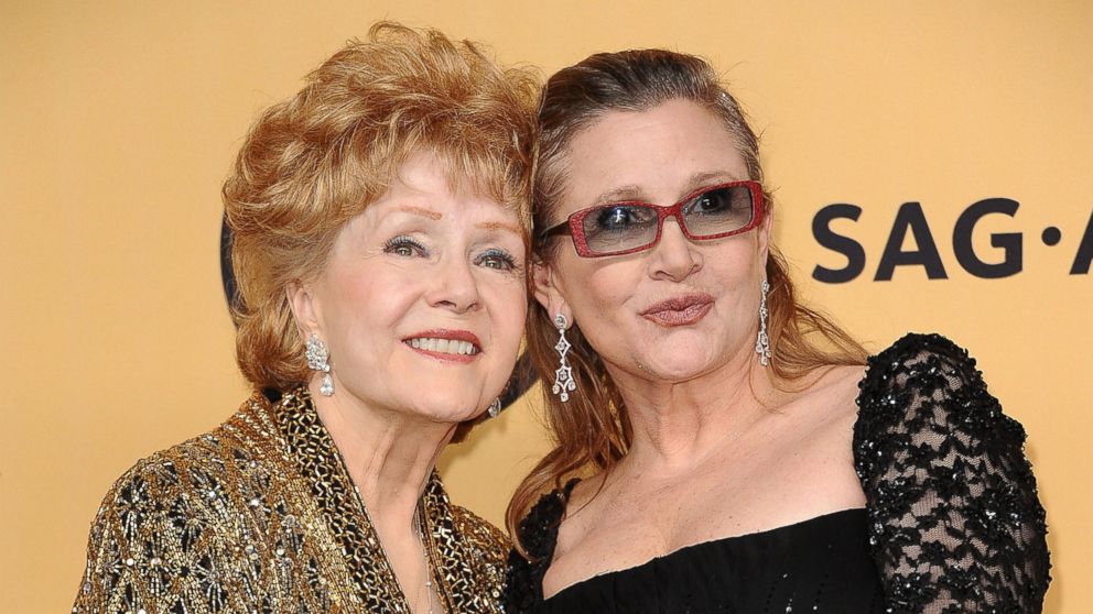 Actresses Debbie Reynolds and Carrie Fisher pose in the press room at the 21st annual Screen Actors Guild Awards at The Shrine Auditorium, Jan. 25, 2015, in Los Angeles.