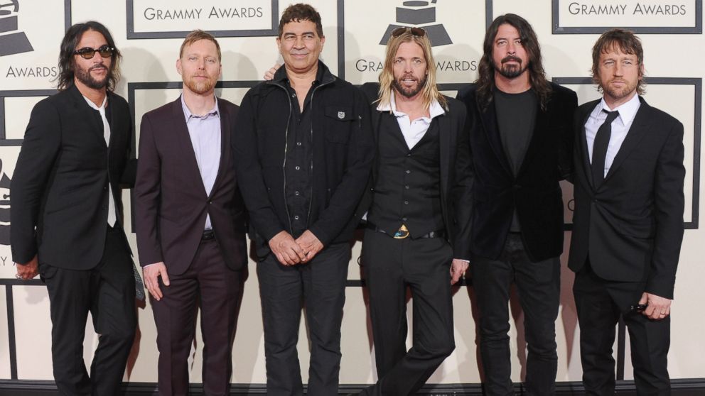 Franz Stahl, Nate Mendel, Pat Smear, Taylor Hawkins, Dave Grohl and Chris Shiflett of Foo Fighters arrive at The 58th Grammy Awards, Feb. 15, 2016, in Los Angeles.