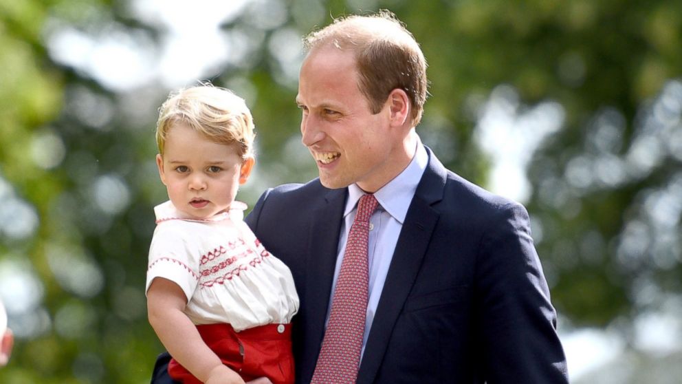 Prince William, right, and Prince George, left, walk past crowds as they leave the Church of St. Mary Magdalene on the Sandringham Estate after the christening of Princess Charlotte of Cambridge on July 5, 2015 in King's Lynn, England.