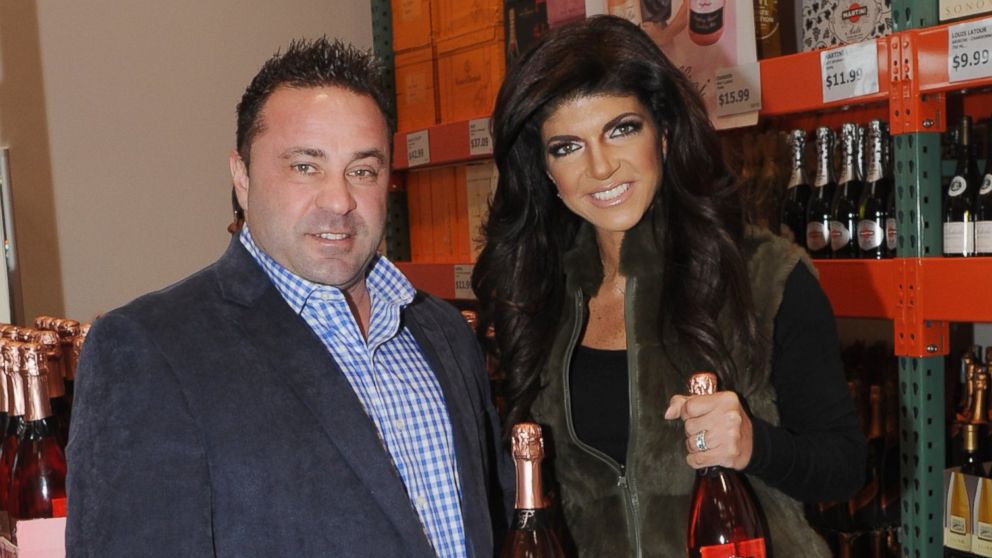 Joe Giudice, left, and Teresa Giudice, right, attend the Fabellini bottle signing and tasting at Costco on March 1, 2014 in Plainfield, N.J. 
