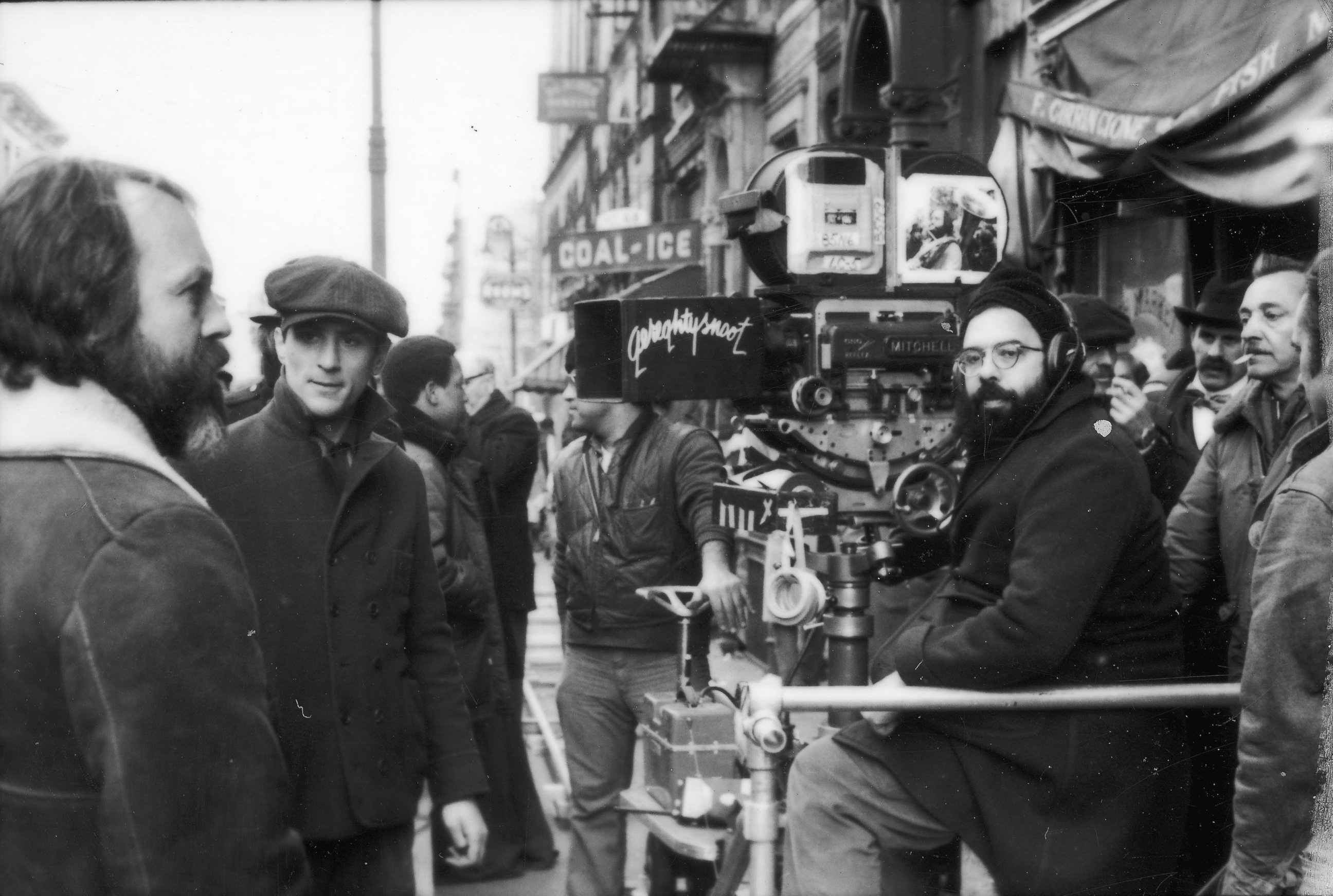 PHOTO: American director Francis Ford Coppola sitting with the camera on the set of his film "The Godfather; Part II," 1974. Robert DeNiro is standing at left.