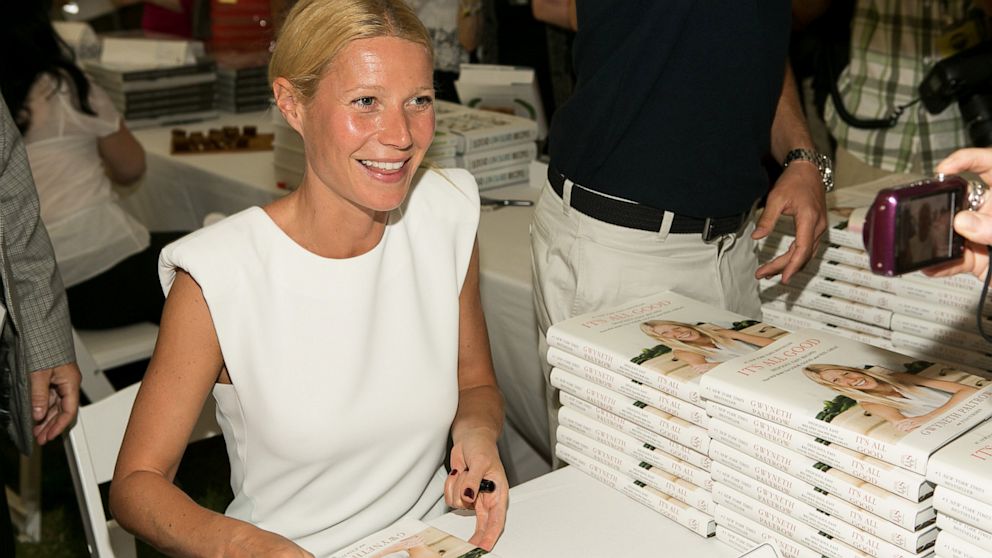 Gwyneth Paltrow signs books during Authors Night For The East Hampton Library at Gardiner's Farm, Aug. 10, 2013, in East Hampton, New York.