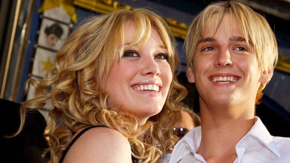 Hilary Duff hugs Aaron Carter as they attend the premiere of The Lizzie McGuire Movie, April 26, 2003, in Hollywood, Calif.