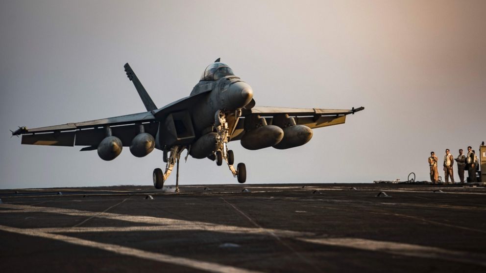 PHOTO: This July 31, 2016, US Navy handout photo shows an F/A-18F Super Hornet preparing to make a landing on the flight deck of the aircraft carrier USS Dwight D. Eisenhower in the Arabian Gulf after a mission in support of Operation Inherent Resolve.