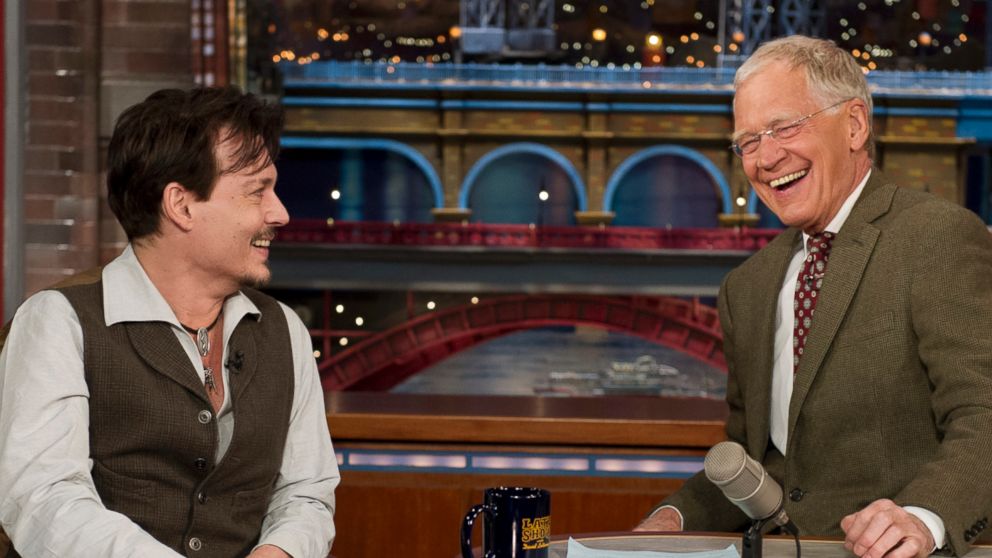 Johnny Depp, left, chats with David Letterman, right, on April 3, 2014 in New York City. 