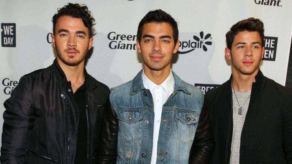 The Jonas brothers pose during the red carpet session before the We Day Minnesota event at the Xcel Energy Center in St. Paul, Minn., Oct. 8, 2013.